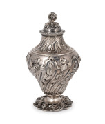 A fine quality antique English tea caddy, attractively adorned with repousse decoration and unusual floral finial top, made in London, circa 1765, 15cm high, 262 grams