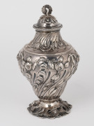 A fine quality antique English tea caddy, attractively adorned with repousse decoration and unusual floral finial top, made in London, circa 1765, 15cm high, 262 grams - 2
