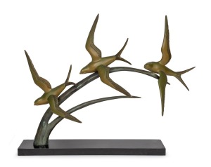 A French Art Deco patinated spelter flying seagull statue on black marble base, circa 1930, 57cm high, 70cm wide.