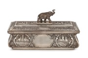 An antique Indian silver casket with repousse decoration and elephant finial, interior fitted with sandalwood, 19th century, 16cm high, 30cm wide, 1190 grams including timber lining.