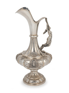 An antique 800 silver wine ewer with figural handle and profile portrait vignettes, 19th century, 43cm high, 1590 grams.