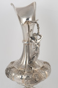 An antique 800 silver wine ewer with figural handle and profile portrait vignettes, 19th century, ​​​​​​​43cm high, 1590 grams. - 2
