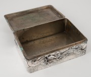 An antique Japanese export silver box decorated with dragons and clouds, Meiji Period, 19th century, 6cm high, 15.5cm wide, 11cm deep, 524 grams. - 3