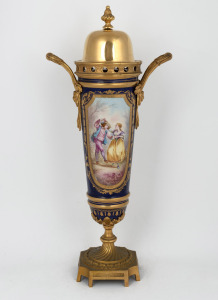 An antique French blue and gilt porcelain urn with hand-painted vignettes and gilt metal mounts, 19th/20th century, 48cm high.