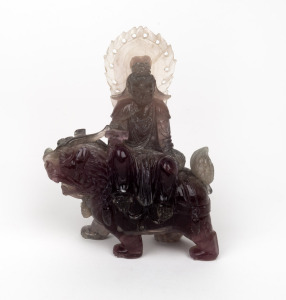 A Chinese carved hardstone figure riding on a mythical creature, 19th/20th century, ​​​​​​​16cm high.