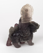 A Chinese carved hardstone figure riding on a mythical creature, 19th/20th century, ​​​​​​​16cm high. - 2