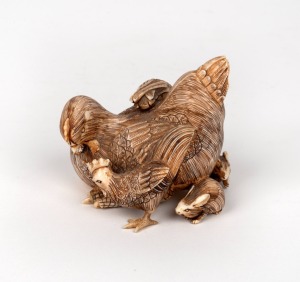 An antique Japanese carved ivory okimono figural group of a hens, rabbits, chick and duck, Meiji Period, seal mark to base, 7cm high, 8cm wide.