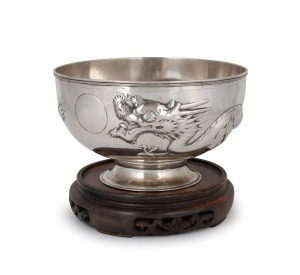 TUCK CHANG & Co. of Shanghai Chinese export silver dragon bowl on later wooden stand by noted silversmith GAN SHENG of Hong Kong, 19th/20th century, 11.5cm high (not including base), 19.5cm diameter, 573 grams. Gan Sheng (active circa 1895-1930) operated in Hong Kong and is known for his discerning eye for style and quality. He skilfully blended Chinese decorative motifs with neoclassical Western forms. Works bearing his marks are scarce.