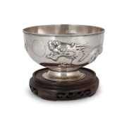 TUCK CHANG & Co. of Shanghai Chinese export silver dragon bowl on later wooden stand by noted silversmith GAN SHENG of Hong Kong, 19th/20th century, 11.5cm high (not including base), 19.5cm diameter, 573 grams. Gan Sheng (active circa 1895-1930) operated