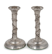 A rare pair of antique Chinese export silver candlesticks with dragon decoration, 19th/20th century, 16.5cm high, weighted bases, 615 grams total.
