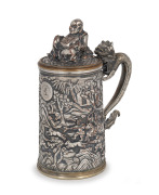 An antique Chinese silver plated export ware tankard and cover, handsomely decorated with dragon handle, seated Buddha and battle scene, engraved "RAGLAN ARCHERS, Aug. 26. 1868", ​​​​​​​17cm high.