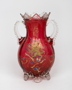 An antique ruby glass mantle urn with hand-painted griffin motif in gilt and enamel, 19th century, 30cm high.