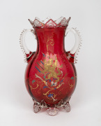 An antique ruby glass mantle urn with hand-painted griffin motif in gilt and enamel, 19th century, 30cm high.