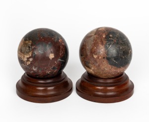 GRAND TOUR pair of carved marble spheres on turned timber stands, 19th century, 15cm high overall.