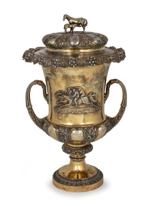 A superb Georgian gilded sterling silver two handled lidded trophy cup adorned with applied action racing scene with mare and foal finial, made by Benjamin Smith of London, circa 1828, 47cm high, the lid 29cm wide, 3730 grams.