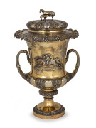 A superb Georgian gilded sterling silver two handled lidded trophy cup adorned with applied action racing scene with mare and foal finial, made by Benjamin Smith of London, circa 1828, 47cm high, the lid 29cm wide, 3730 grams.