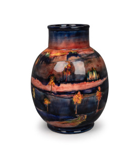 MOORCROFT English pottery vase decorated with trees in landscape and rare flambe glaze, underglazed blue signature mark "W. Moorcroft, 1941" with impressed signature mark and original paper label "By Appointment, Potter to H. M. The Queen", 28cm high.