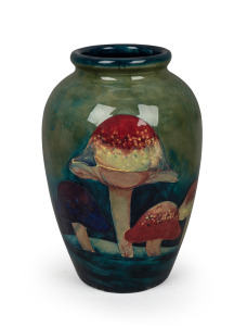 MOORCROFT "Claremont" English pottery vase on celadon green ground, (Note: Base holed for lamp conversion), underglazed blue signature mark "W. Moorcroft" with original paper label and impressed mark, 31.5cm high