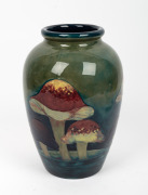 MOORCROFT "Claremont" English pottery vase on celadon green ground, (Note: Base holed for lamp conversion), underglazed blue signature mark "W. Moorcroft" with original paper label and impressed mark, 31.5cm high - 2
