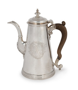 A Georgian sterling silver coffee pot with fruitwood handle and engraved armorial crest, made in London, circa 1779, 22cm high, 716 grams (including handle).