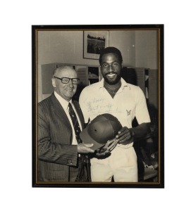 VIV RICHARDS: Original signature and dedication on large format black and white photograph, on the occasion of his visiting Don Bradman and asking him to sign his batting helmet; framed and glazed, overall 53.5 x 43cm.
