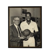 VIV RICHARDS: Original signature and dedication on large format black and white photograph, on the occasion of his visiting Don Bradman and asking him to sign his batting helmet; framed and glazed, overall 53.5 x 43cm.