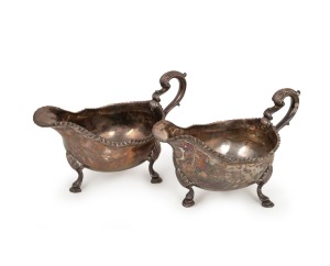 A pair of Georgian sterling silver sauce boats by William Fearn of London, circa 1771, 11cm high, 21cm wide, 746 grams total.