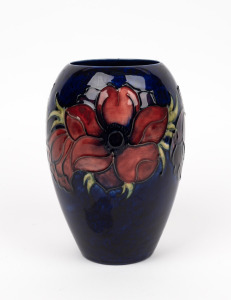 MOORCROFT "Anemone" English pottery vase with blue ground, impressed factory mark to base, with conjoined monogram "W.M." plus additional signature "J. Moorcroft", ​​​​​​​18.5cm high.