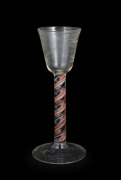 An antique cordial glass with blue, red and white cotton twist stem, 18th century, 14.5cm high