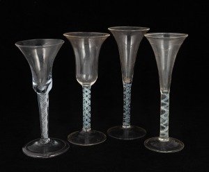 Four antique glasses with twist stems, 18th century, the largest 18cm high.