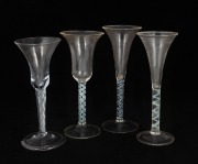 Four antique glasses with twist stems, 18th century, the largest 18cm high.