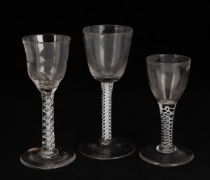 Three antique glasses with twist stems, 18th century, ​​​​​​​the largest 14.5cm high.