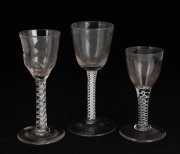 Three antique glasses with twist stems, 18th century, ​​​​​​​the largest 14.5cm high.