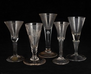Five antique glasses, including engraved example, hollow stem, and air bubble stem, 18th century, the largest 16.5cm high.