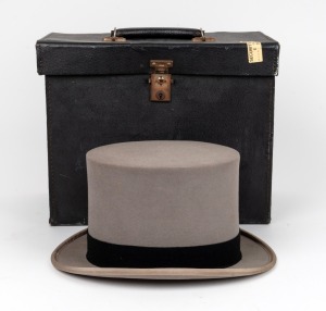 An antique grey top hat in original fitted case, retailed by Henry Buck's of Melbourne
