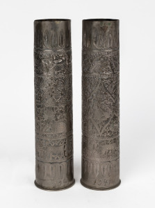A pair of Trench Art artillery shells decorated with Egyptian motifs and dated 1941, 35cm high.