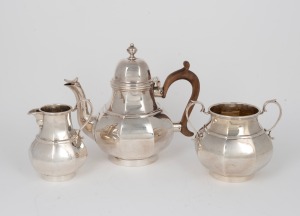 A vintage English sterling silver tea service, made in London, 20th century, (3 items), the largest 15cm high, 835 grams total (including timber handle).
