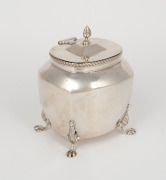 An antique sterling silver tea caddy with paw feet, made in Birmingham, circa 1900, 11cm high, 188 grams.