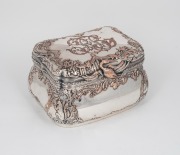 An antique French silver plated jewellery casket with repousse decoration, signed "HALPERN", interior attractively lined in scarlet silk diamond button upholstery, 19th century, ​​​​​​​13cm high, 20cm wide, 16cm deep.