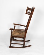 An antique Lancashire rocking nursing chair, elm and fruitwood with rush seat, circa 1800, 115cm high, 56cm across the arms - 2