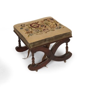 An antique English mahogany footstool with tapestry top and original brass castors, mid 19th century, as is condition, restorer's piece in barn find condition, 38cm high, 49cm wide, 49cm deep