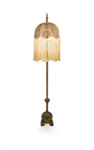 A vintage cast metal and brass standard lamp with hand-painted floral decoration and tasseled lace shade, early to mid 20th century, 160cm high overall