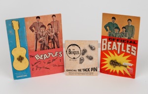 THE BEATLES: A group of tie tack pins, still mounted on their original cards of issue. Comprising four individual heads, one a composite of four heads plus a composite of the four heads with a guitar labelled "The Beatles." Created by Nems Enterprises. (6