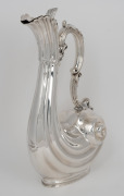 An antique sterling silver Rococo Revival shell form claret jug by Walker & Hall, Chester, circa 1906, 33cm high, 980 grams. - 2