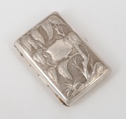 A Chinese export silver cigarette case with repousse blossom and tree decoration, 19th/20th century, 8cm high, 73 grams.