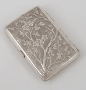A Chinese export silver cigarette case with repousse blossom and tree decoration, 19th/20th century, 8cm high, 73 grams. - 2