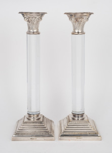 A pair of candlesticks with faceted glass columns, silver plated capitals and bases, 20th century, ​​​​​​​26cm high.