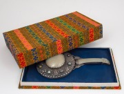 A Chinese silver and carved mutton jade hand mirror adorned with cabochon semi-precious stones and housed in a later silk box, 24cm high. - 3