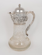 An antique English crystal claret jug with Bacchanalian silver plated mounts and barrel finial, 19th/20th century, 31cm high.
