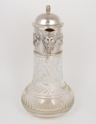 An antique English crystal claret jug with Bacchanalian silver plated mounts and barrel finial, 19th/20th century, 31cm high. - 2